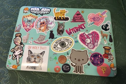 Rachel's cute MacBook Pro, covered in stickers.