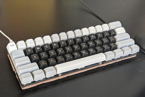 A photo of Serena's black and white mechanical keyboard.